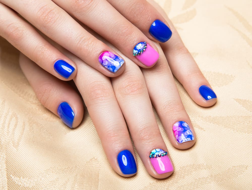 Beautiful colorful manicure with bubbles and crystals