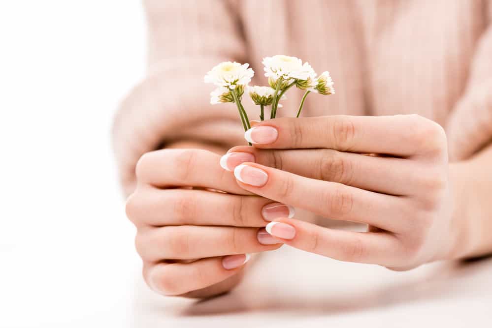 Cropped view of girl with natural manicure