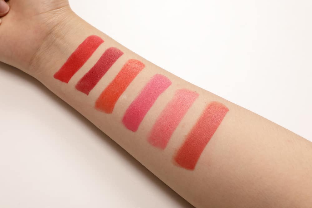 Different colored lipsticks on the arm