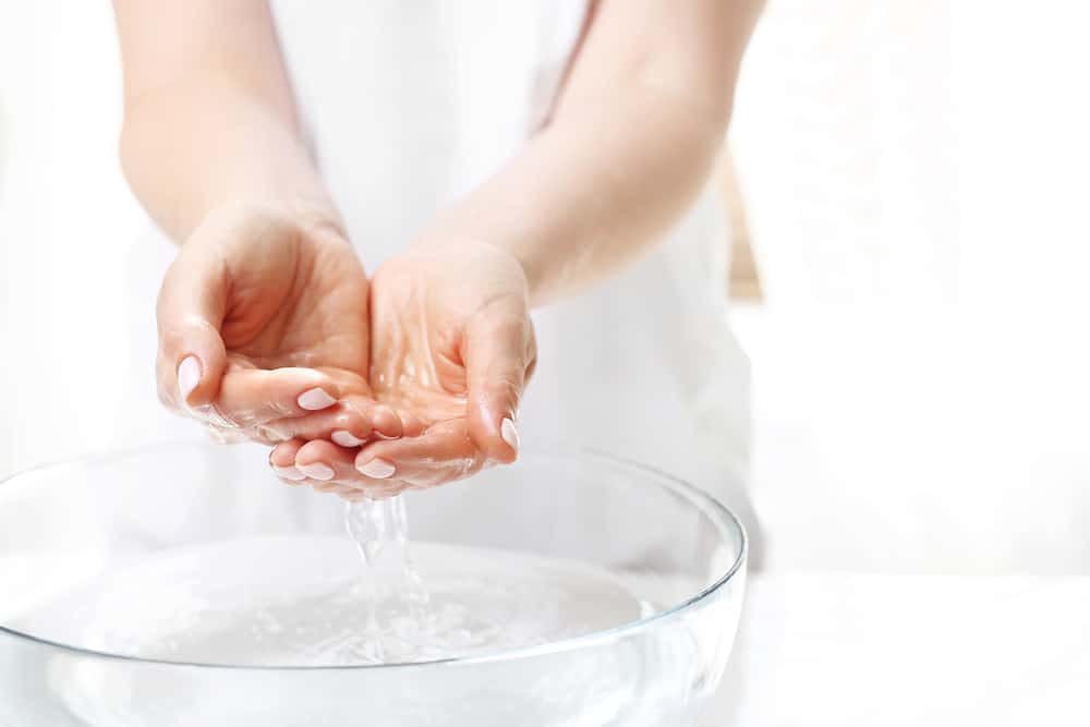 Hand spa. Hand skin care. The woman washes her hands.