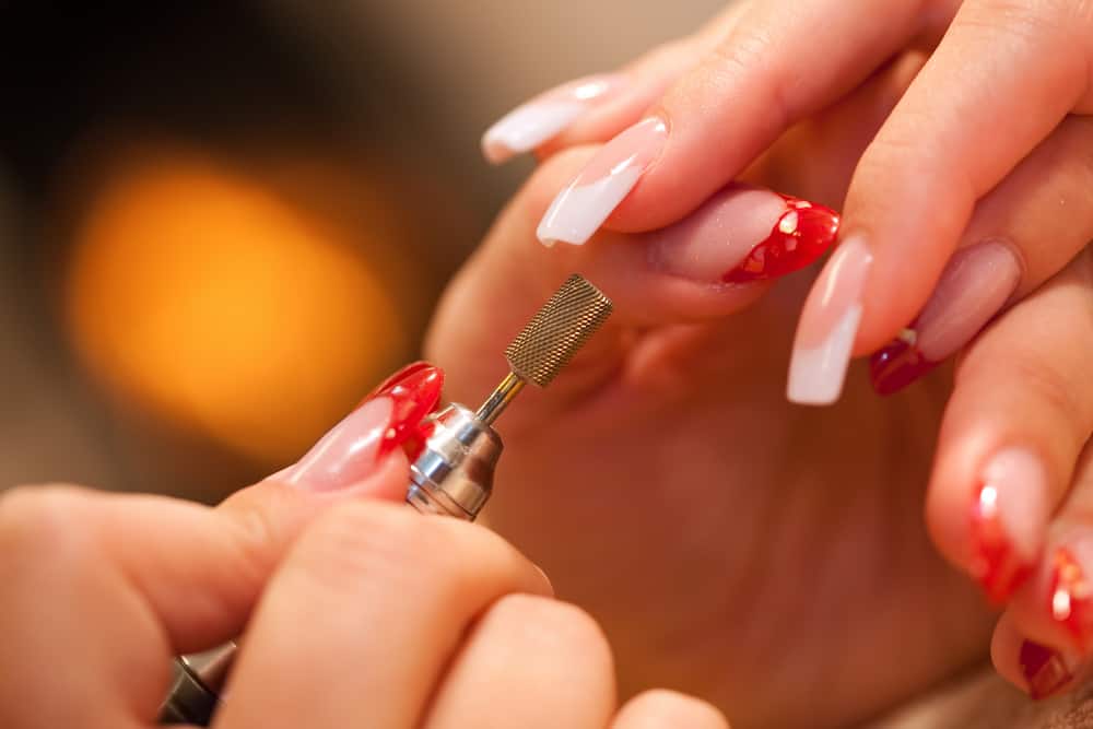 Macro closeup of nail polisher at work