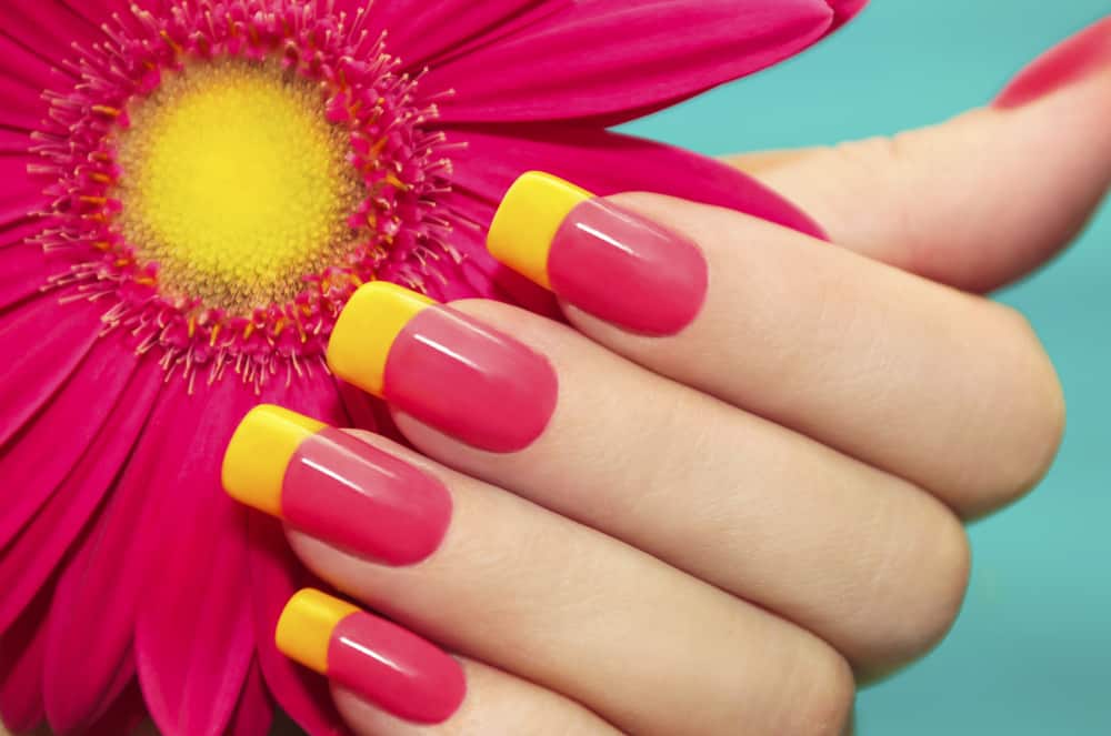 Two-tone manicure with pink and yellow varnish