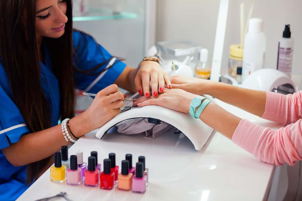 Woman on manicure treatment