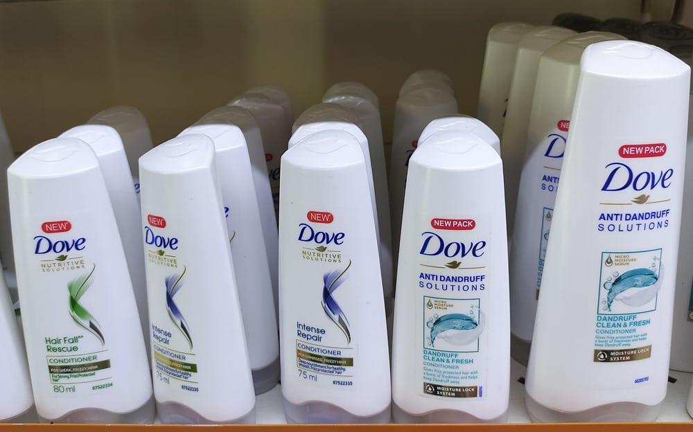 dove anti dandruff shampoo bottles on supermarket