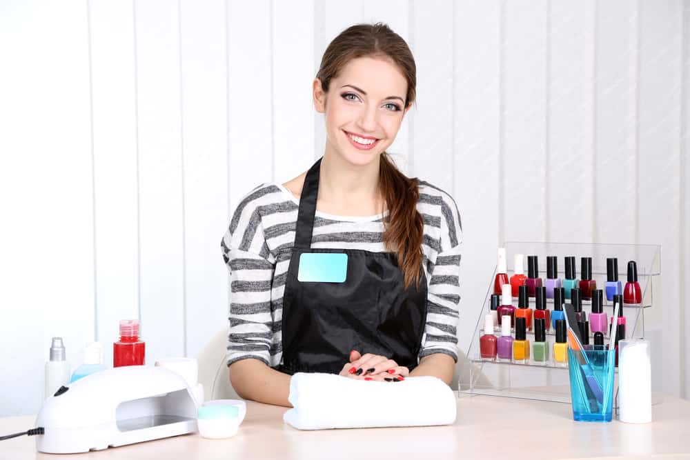 girl manicurist in beauty salon