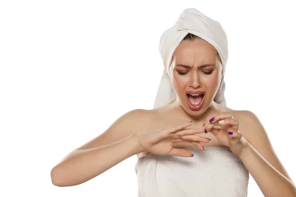 woman posing with a towel on her head with a broken fingernail