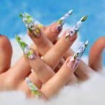 Acrylic flowers on women's nails.