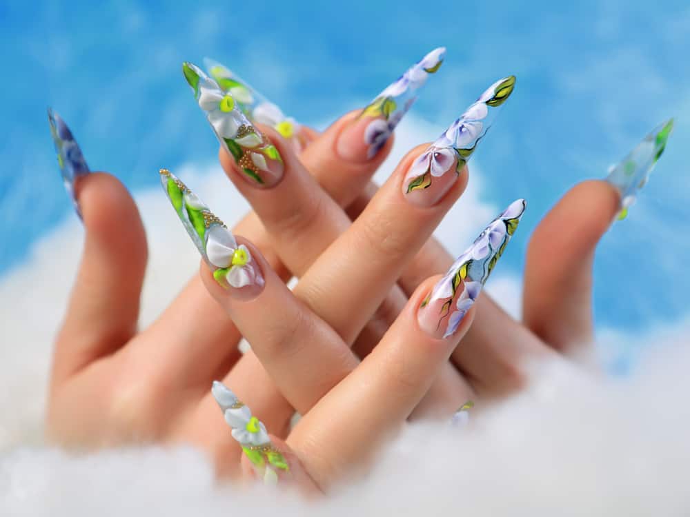 Acrylic flowers on women's nails.