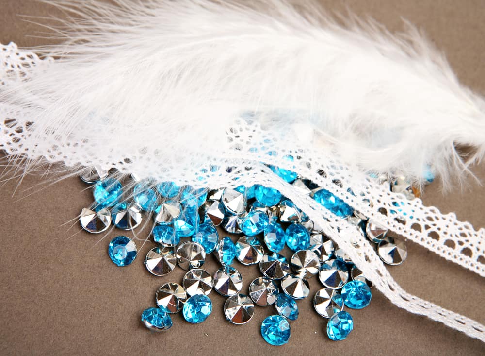 Blue rhinestones and white lace for decoration