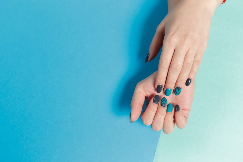 Detail view of stylish trendy female manicure.