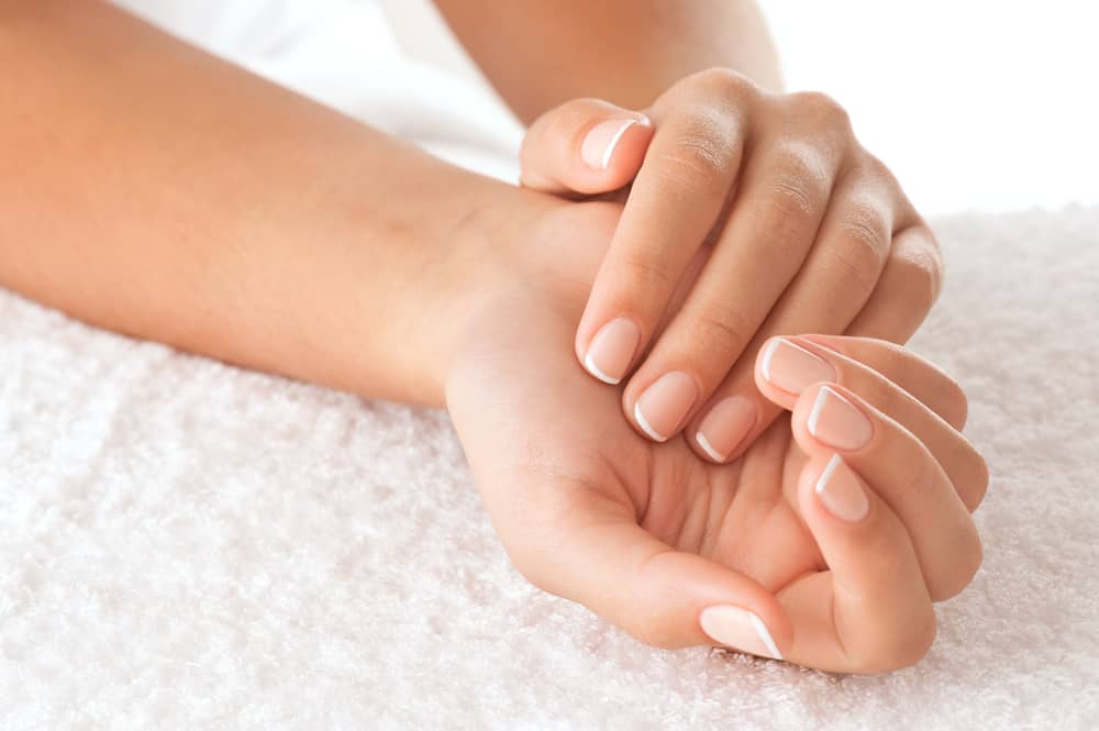 Beautiful hands on the white towel