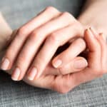 Female Hands on Gray Background