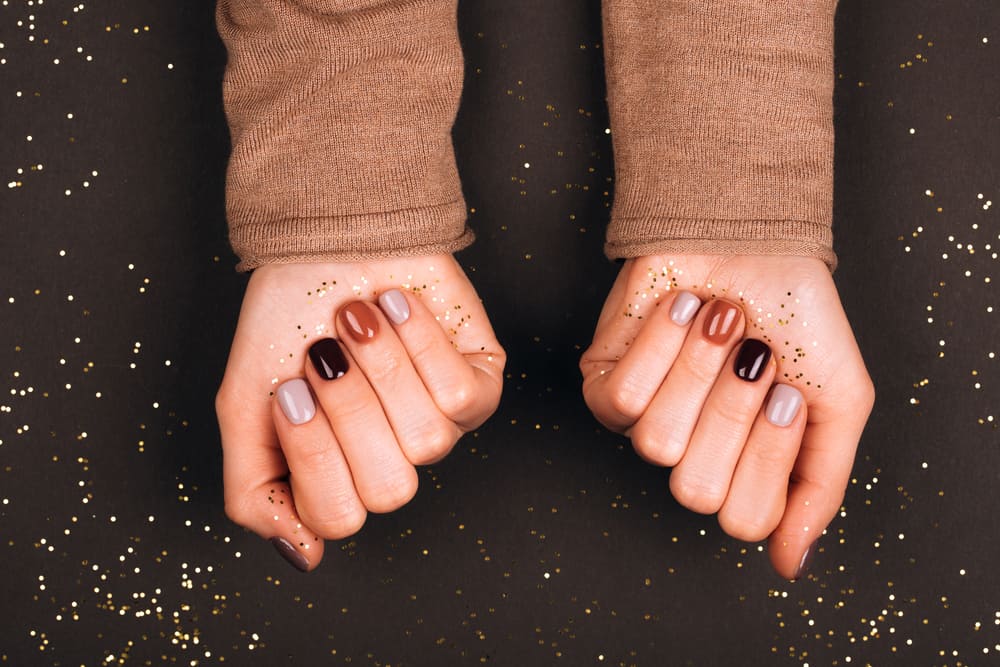 Holiday beautiful manicure with golden decorations